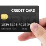 hand-holding-plastic-credit-card-picture-id885367710