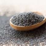 poppy-seeds-in-wooden-spoon-picture-id614972070