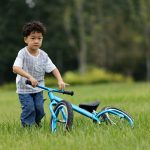 A little boy riding a bicycle
